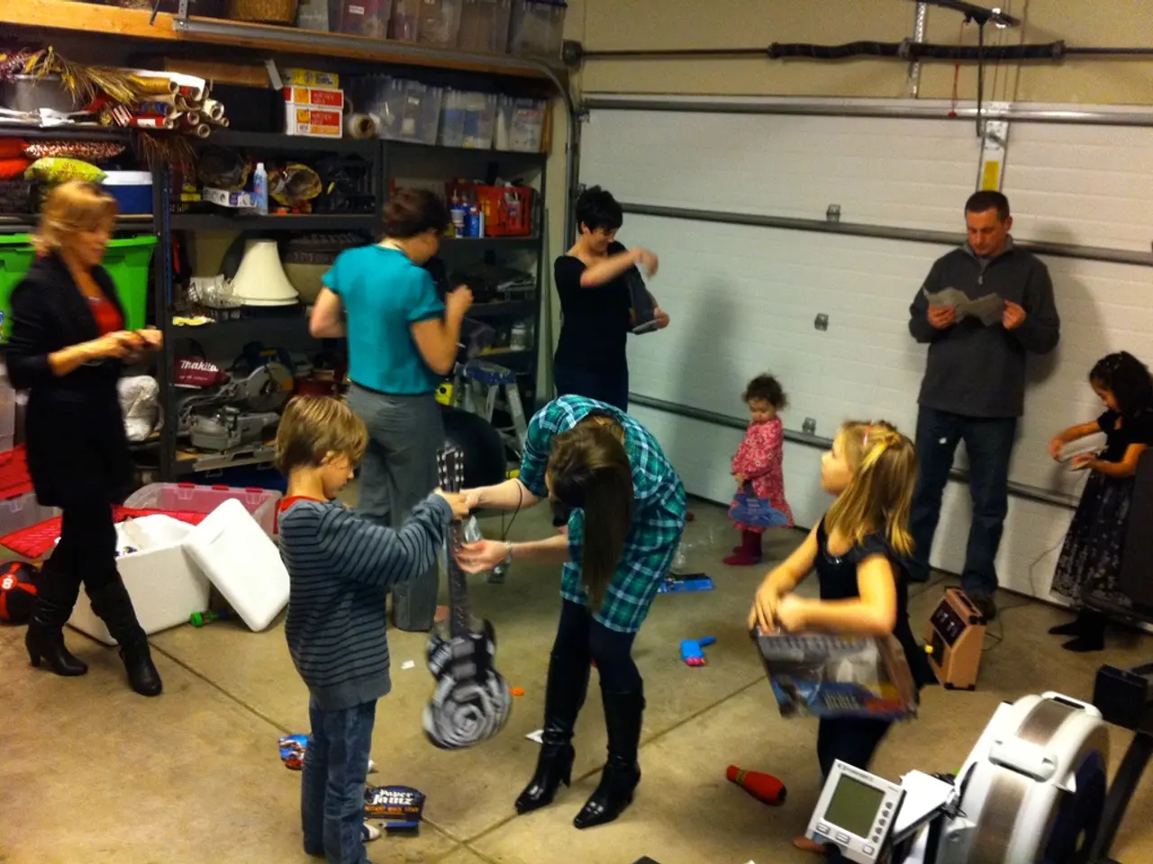 In this picture there are kids and people. The picture is taken in a room, in the room there are...