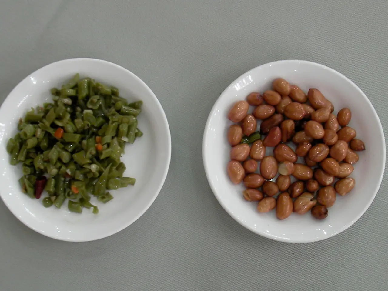 In the right side these are the peanuts in a white color bowl, In the left side these are the...