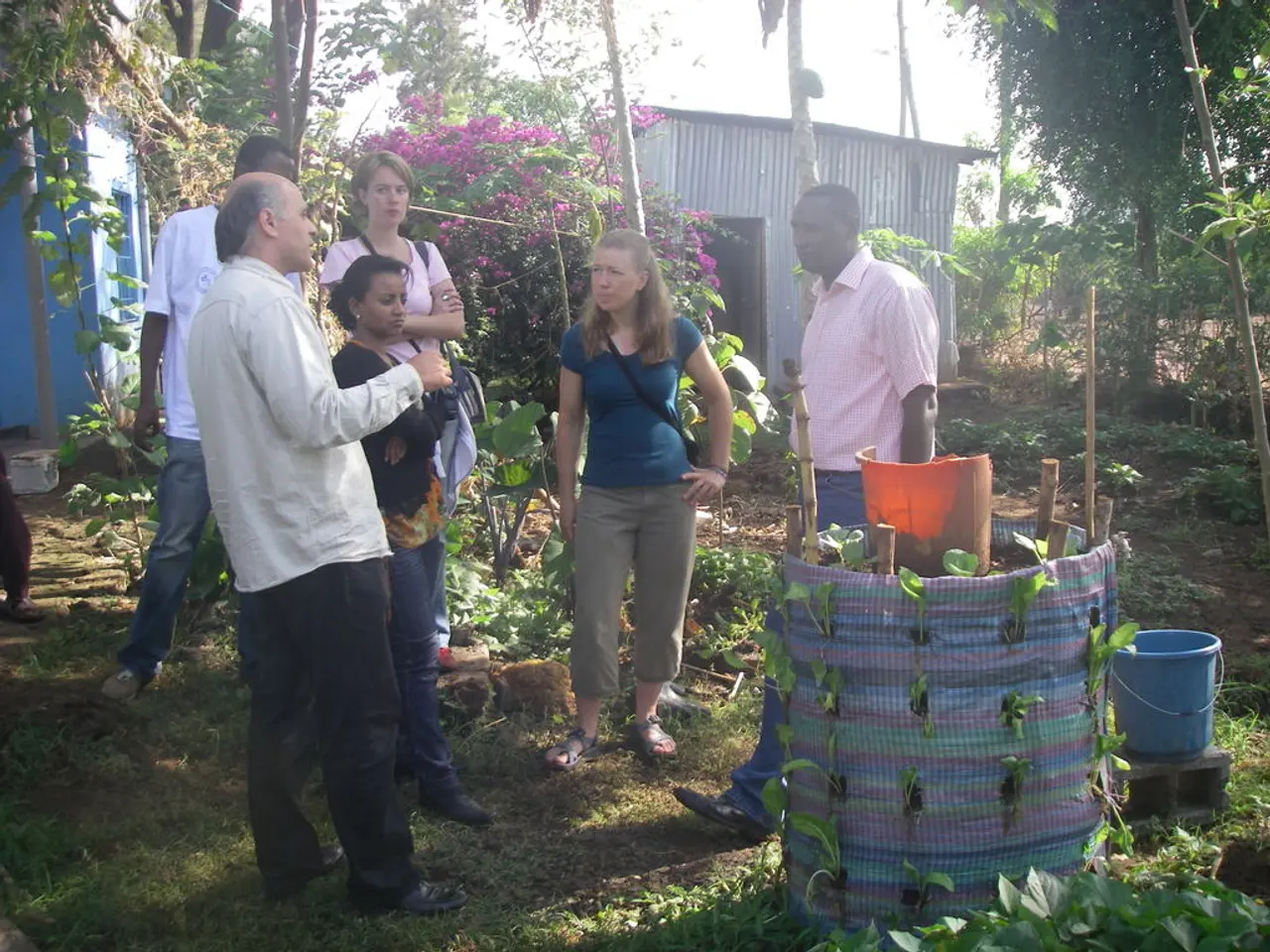 In this picture there are people those who are standing in the center of the image and there is...