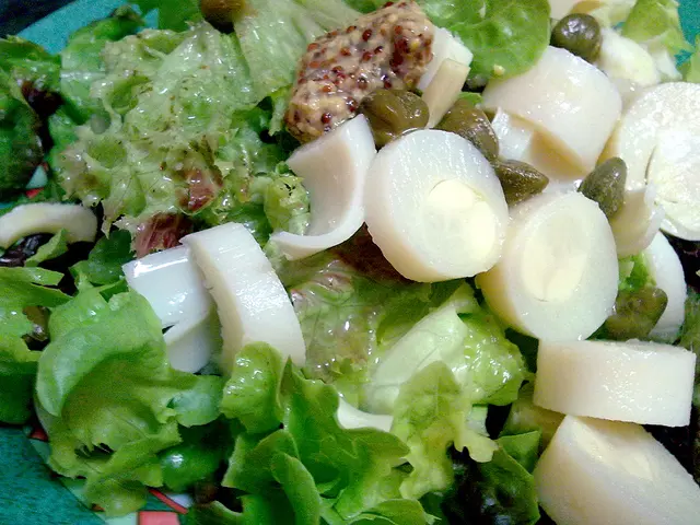 In this image, we can see lettuce salad along with other vegetables.