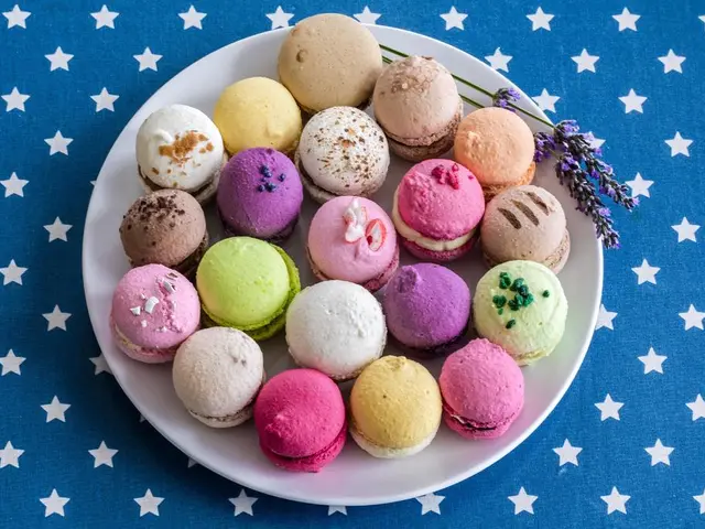 In the image there are some cookies kept on a plate and under the plate there is a cloth with stars...