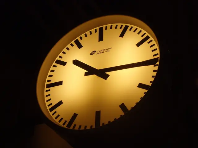 The picture consists of a clock. In the clock there is light. Around the clock it is dark.